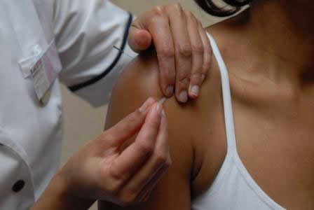 Practitioner diagnosing patients' pulses - &copy; Copyright Purple-World.