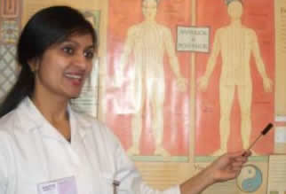 Practitioner diagnosing patients' pulses - &copy; Copyright Purple-World.